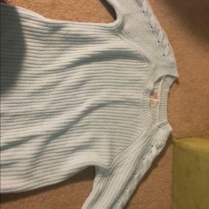 A light baby blue sweater. Size small.